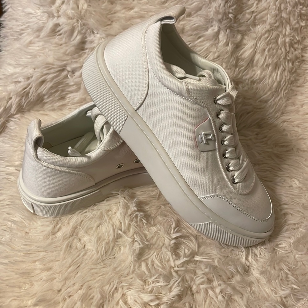 CHRISTIAN LOUBOUTIN
Simplerui logo-detailed leather-trimmed canvas